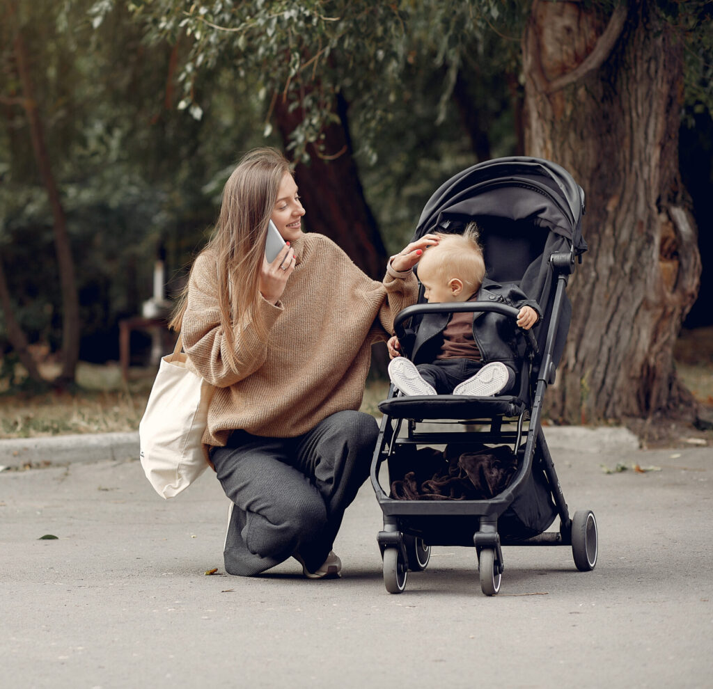 Young Mother Walking Autumn Park With Carriage Scaled E1772716497294 1024x990